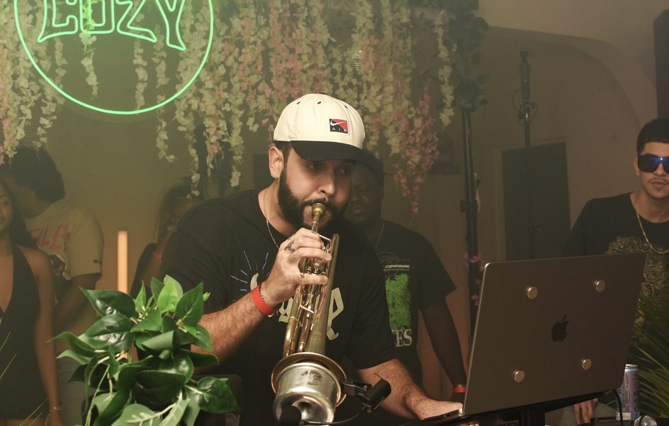 Live saxophone set under the neon sign