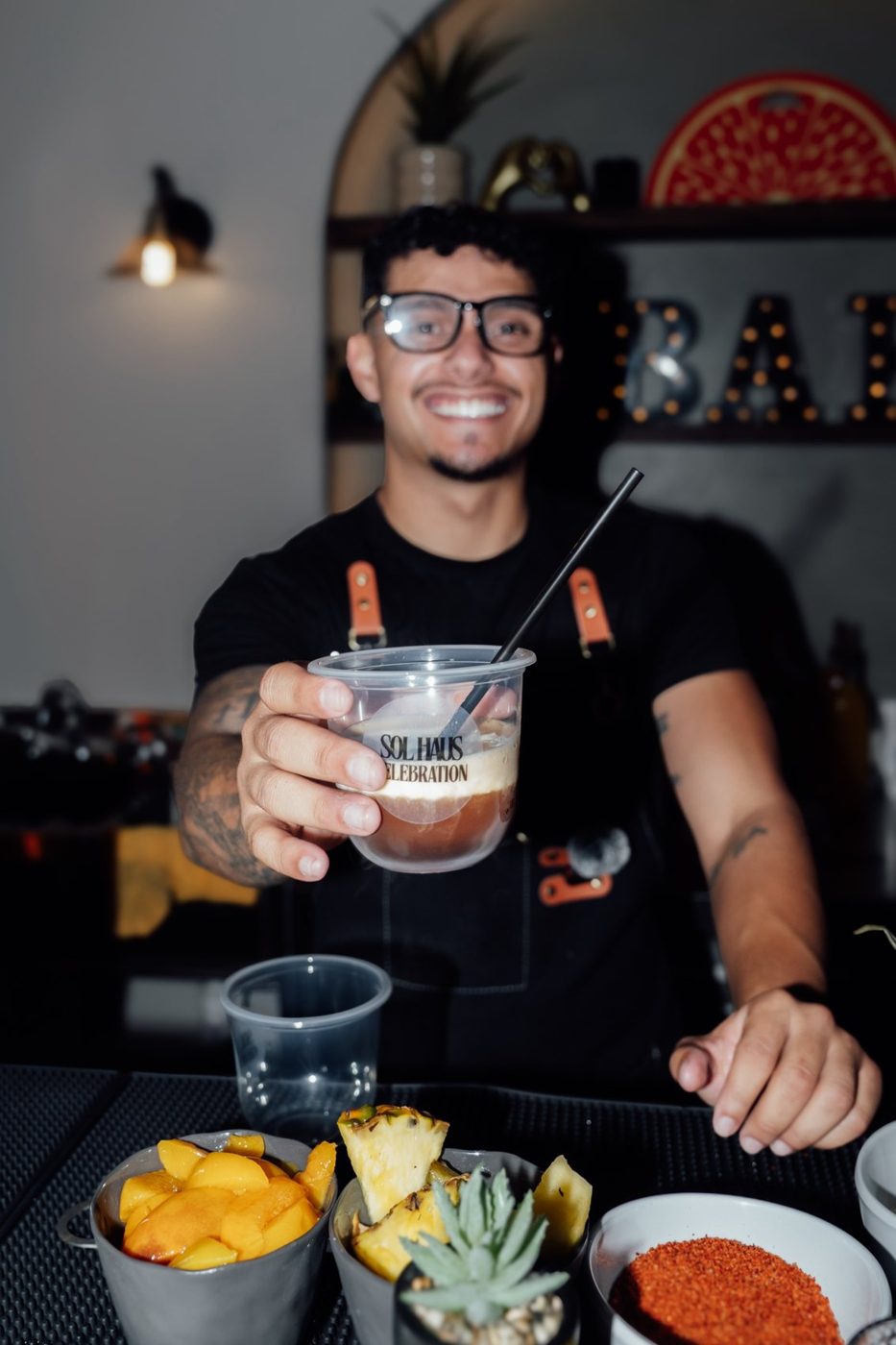 Host raising a glass at a tasting table